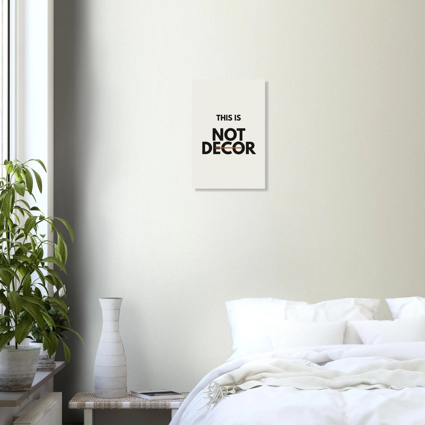 This Is Not Decor statement poster in a minimal white room with shelf and plant