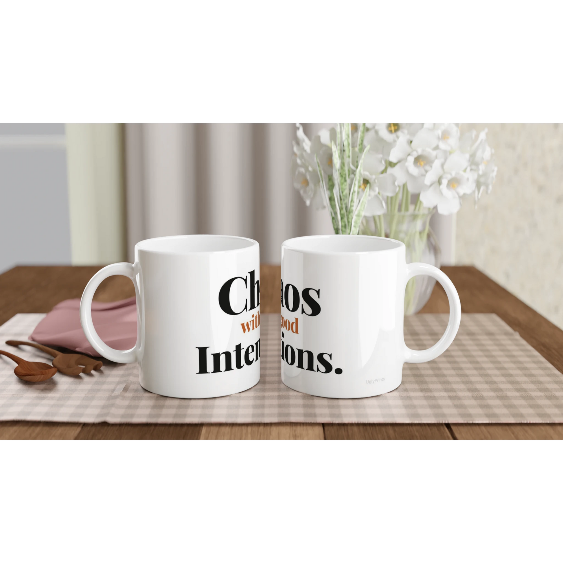 Chaos With Good Intentions funny typography mugs on table with flowers lifestyle setting