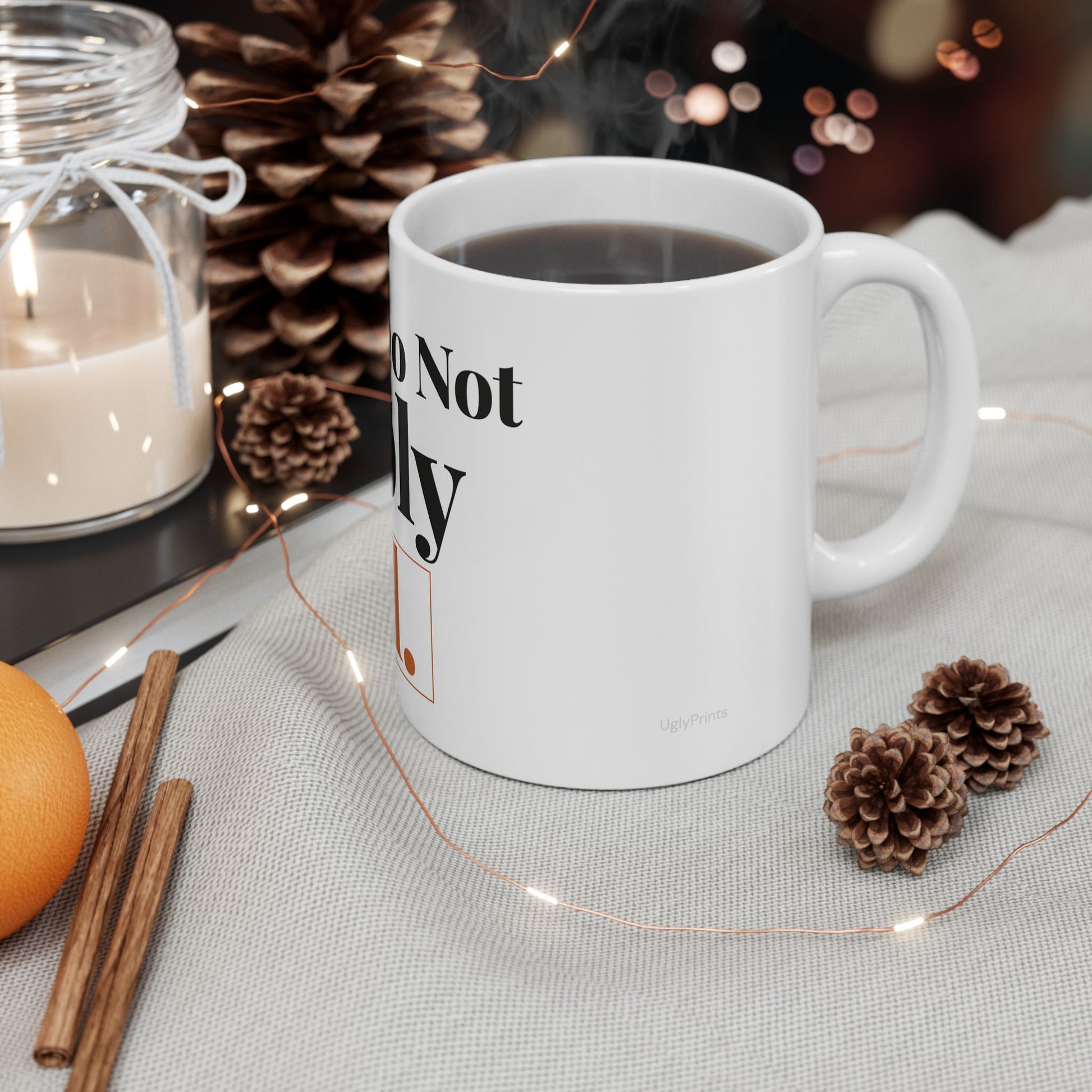Please Do Not Reply All funny office mug styled in a warm cosy setting with pine cones cinnamon and fairy lights