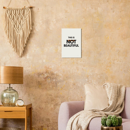 This Is Not Beautiful typography poster on a warm textured wall with lamp and armchair