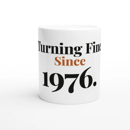 Turning Fine Since 1976 — 11oz white ceramic funny birthday mug front view