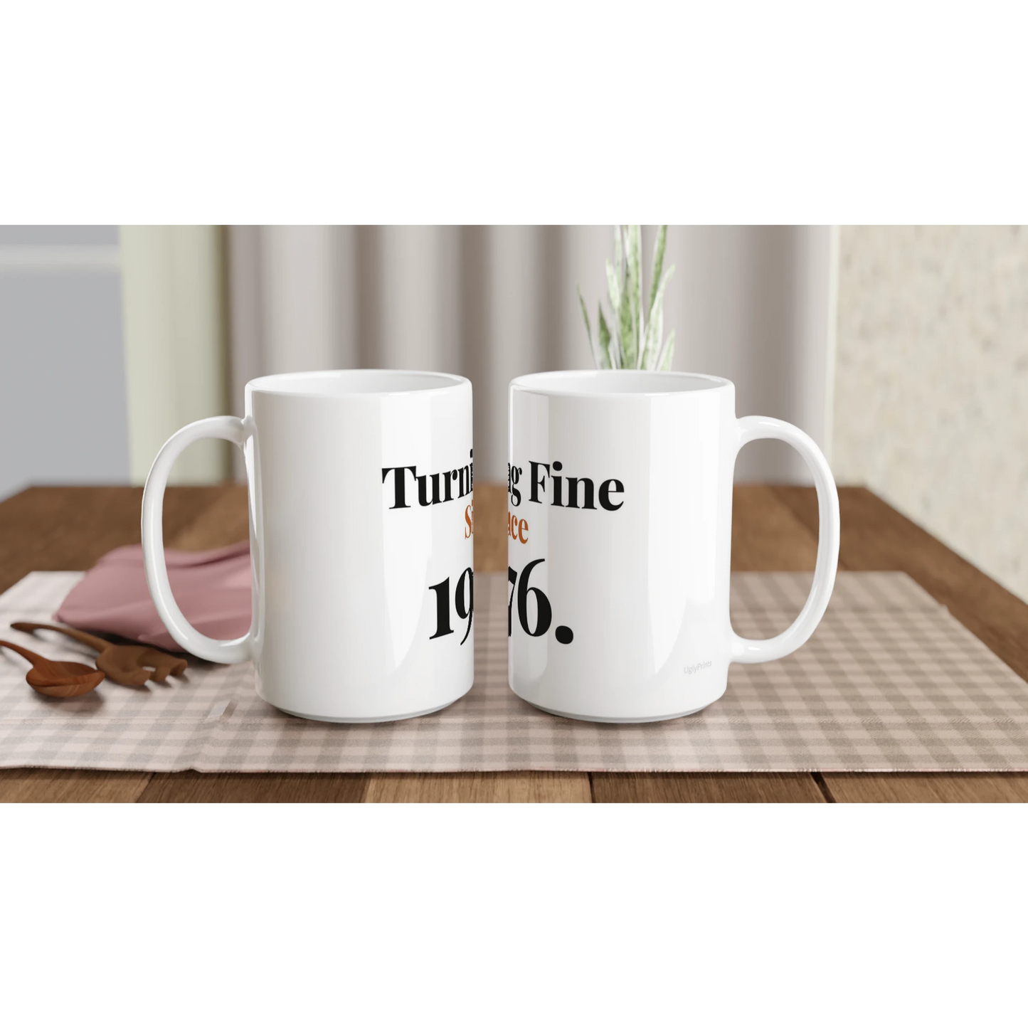 Turning Fine Since 1976 funny birthday mugs on table with flowers lifestyle setting