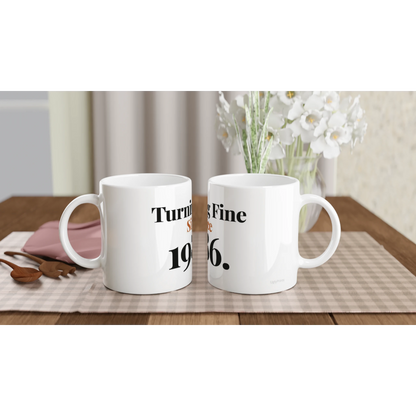 Turning Fine Since 1986 funny birthday mugs on table with flowers lifestyle setting
