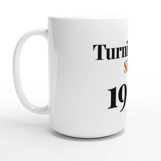 Turning Fine Since 1996 — 15oz white ceramic funny birthday mug angled side view