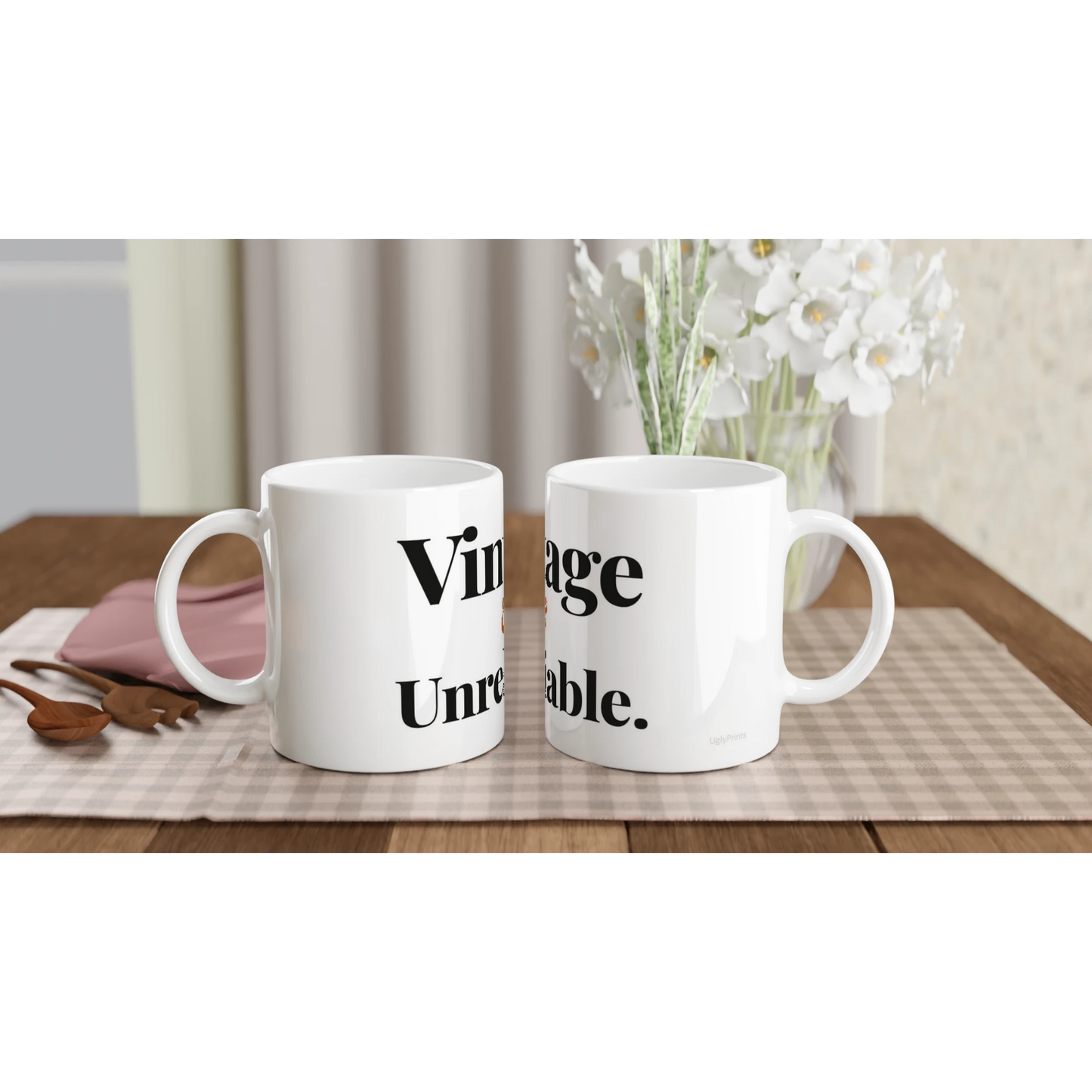 Vintage And Unreliable funny birthday mugs on table with flowers lifestyle setting